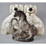 A Pair of Beswick Staffordshire Spaniels, no.1378-3, 26cm high Together with a Staffordshire Rearing