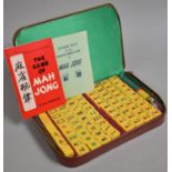 A Mid 20th Century Leather Cased Mah Jong Set with Rules and Instruction Booklets