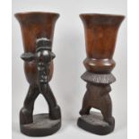 A Pair of Carved African Souvenir Tribal Bottles, One with Mask Head Decoration, 37cm high