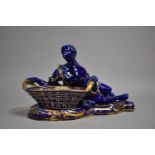 A Continental Cobalt Blue and Gilt Figural Large Table Salt in the Form of Reclining Maiden with