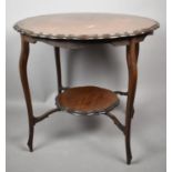 An Edwardian Circular Occasional Table with Stretcher Shelf and Extended Cabriole Supports