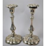 A Pair of Silver Plated Candlesticks, 25cm high