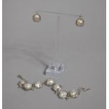 A Suite of Pearl and White Metal Jewellery, Bracelet and Earrings