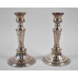 A Pair of Elkington & Co. Hand Chased Electroplate on Copper Candlesticks, 19.5cm high