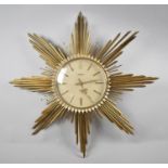 A Mid 20th Century Brass Starburst Clock, The Electrora by Junghans, Battery Movement and Requires