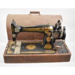 A Vintage Oak Cased Manual Singer Sewing Machine