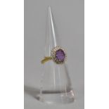 An 18ct Gold, Diamond and Amethyst Cluster Ring, 3.9g