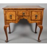 A Crossbanded Burr Walnut Lowboy with Centre Drawer Flanked by Two Deeper Drawers, Cabriole