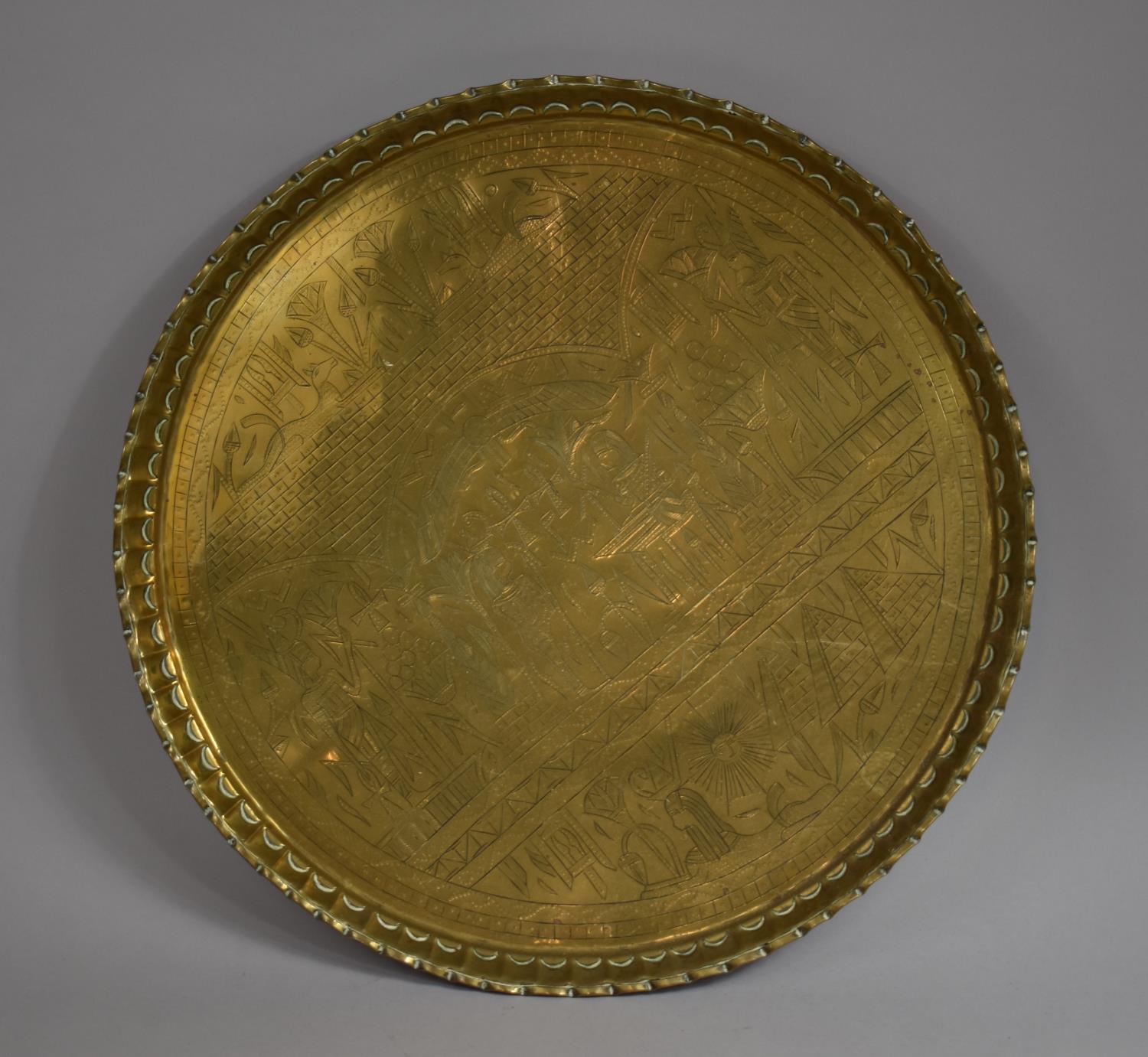 An Egyptian Circular Brass Tray with Engraved Decoration, 52.5cm diameter