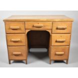 An Art Deco Kneehole Writing Desk, 107cm wide