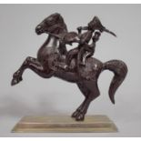 A North Indian or Persian Bronzed Study of Mounted Warrior having Shield and Drawn Sabre with