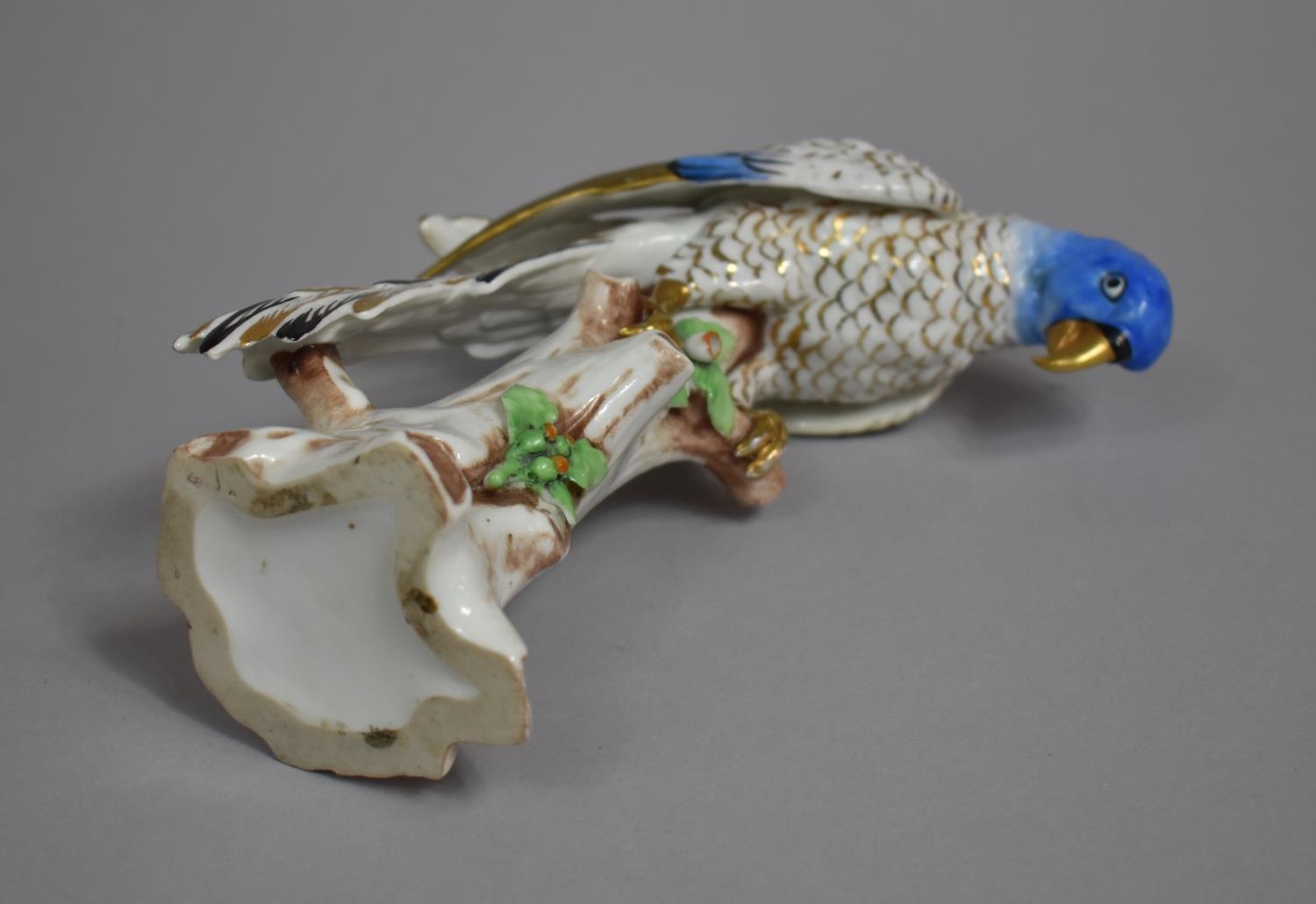 A Continental Porcelain Study of Blue Feathered Parrot on Branch Enriched with Gilt Highlights. - Image 2 of 2