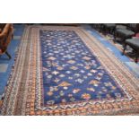 A Very Large Woollen Carpet Square on Blue Ground, 483x252cm