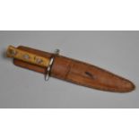 A Vintage Hunting Knife in Leather Sheath