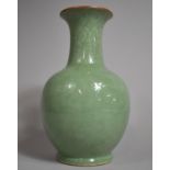 A Chinese Celadon Glazed Vase, Drilled and with Chip Under Neck. 26cms High