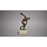 An Italian Bronze or Brass Replica Figure, Discobolus after Myron, Mounted on a White Marble Plinth.