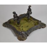 A Cast Iron Victorian Style Boot Scraper on Tray Base