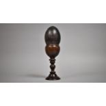 An Emu Egg Mounted on a Turned Wooden Stand. 30cms High