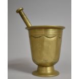 A Large and Heavy Early Bronze Pestle and Mortar, 16cms High