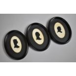A Set of Three Oval Silhouette in Ebonised Frames, 16cm high