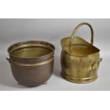 A Brass Helmet Shaped Coal Scuttle and a Two Handled Planter