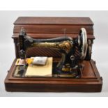 A Vintage Mahogany Cased Manual Singer Sewing Machine