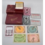 A Collection of Bezique Playing Cards and Scorers
