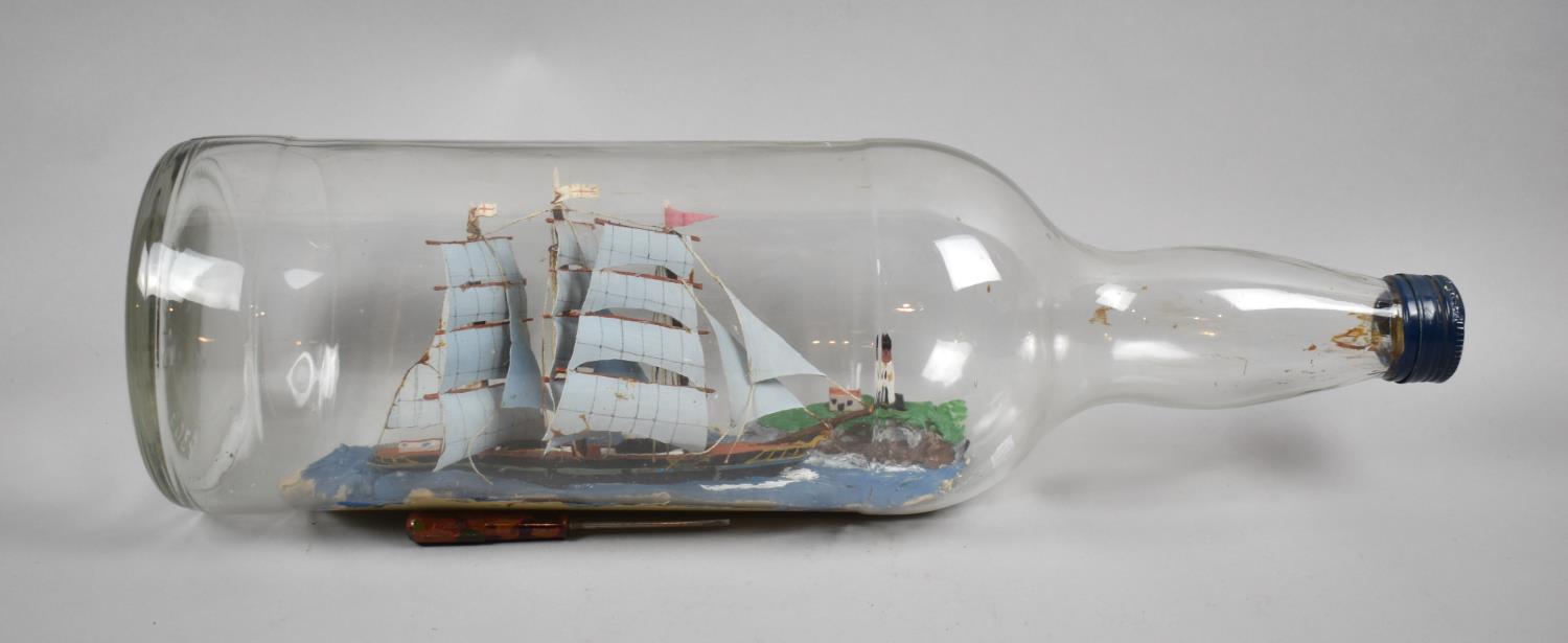 A Large Folk Art Ship in a Bottle, 50cms Long