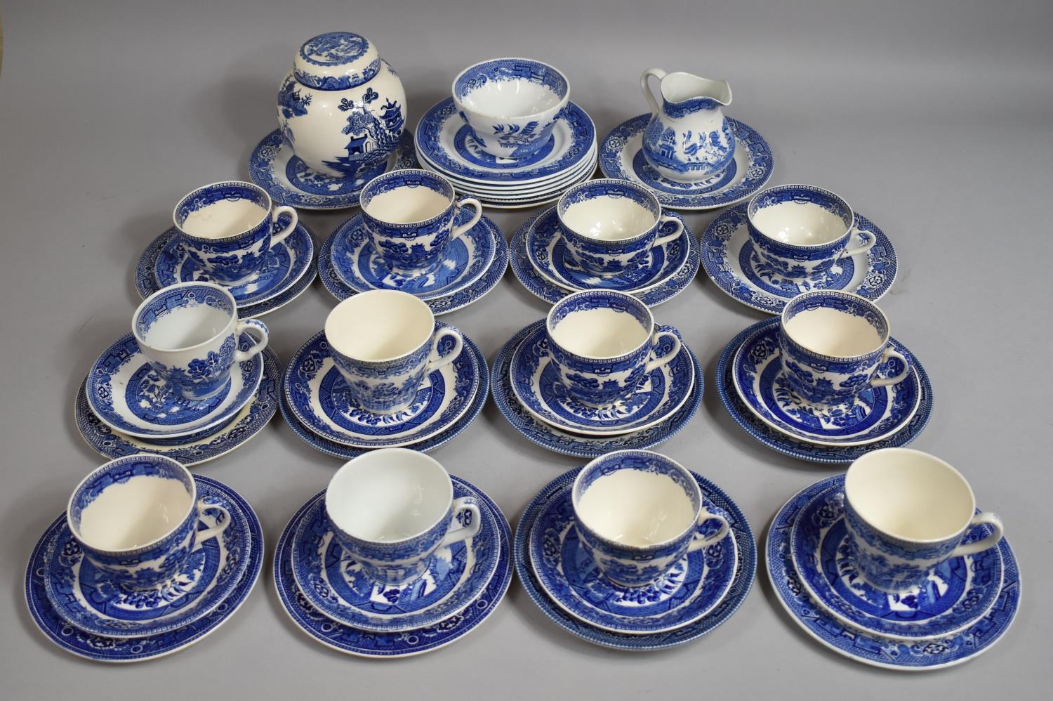 A Collection of Various Blue and White Willow Pattern Teawares to Comprise Cups, Saucers, Side