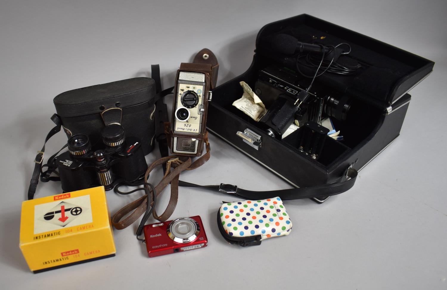 A Chinon 8mm Movie Camera with Sound, Bell and Howell Clockwork Cinecamera, 8x30 Binoculars and