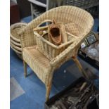 A Wicker Armchair and Four Small Baskets