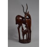 A Large African Carved Wooden Souvenir, Antelope with Calves, 54cms High