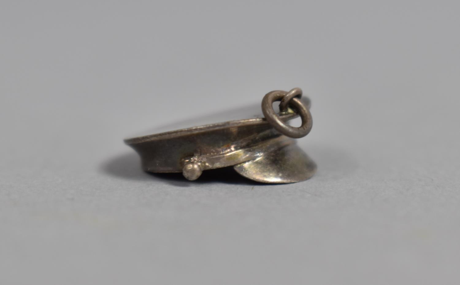 A Vintage Silver Charm in the Form of a Military Cap Stamped Sterling