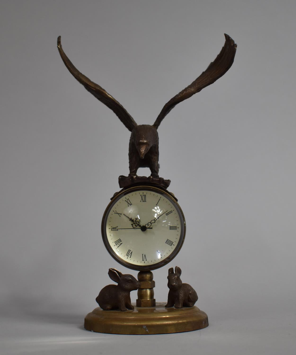 A Reproduction Bronze Novelty Desk Top Ball Clock with Eagle Finial with Out Stretched Wings and Two