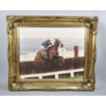 A Gilt Framed Photograph of Racehorse Clearing Final Fence, 49x40cms