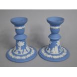 A Pair of Wedgwood Blue and White Jasperware Candlesticks, 12cm high