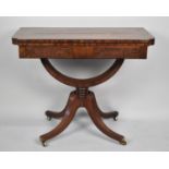 A Nice Quality 19th Century Lift and Twist Top Mahogany Games Table with Ebony Stringing and