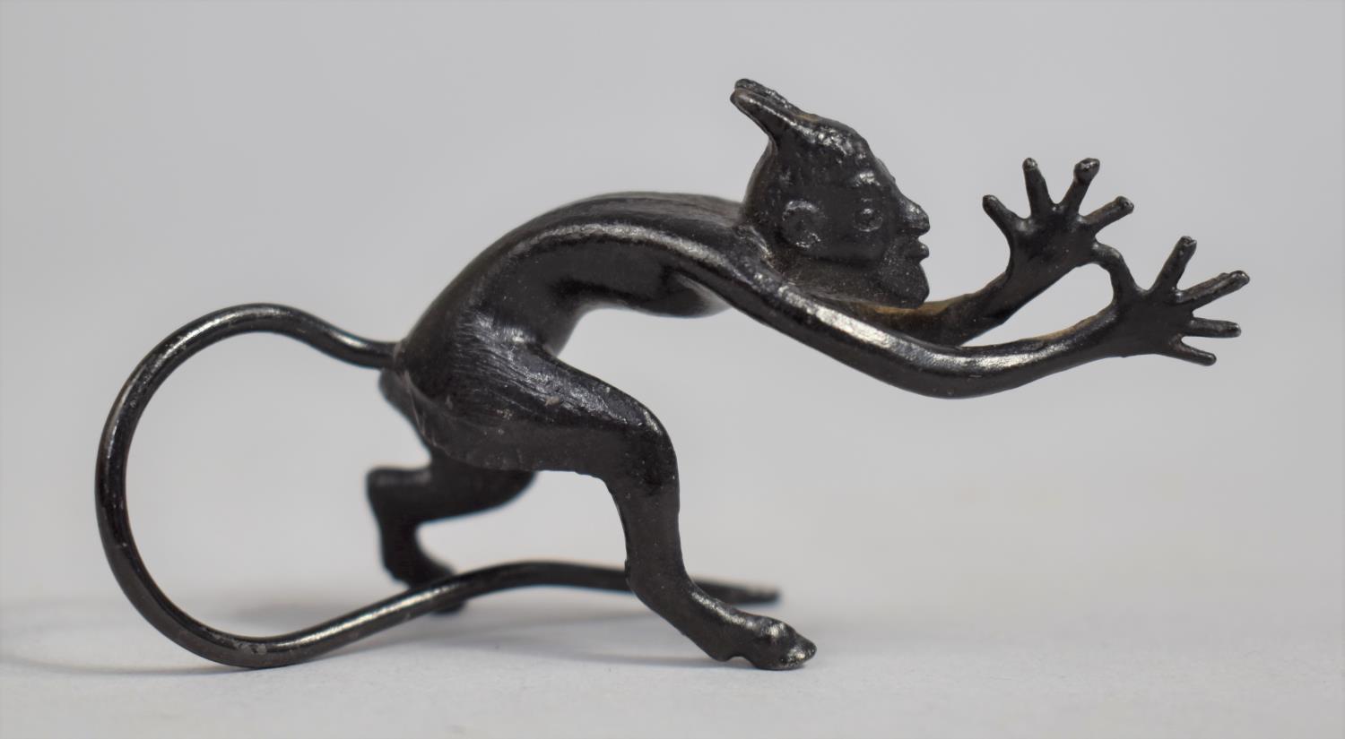 A Small patinated Bronze Study of a Long Tailed Devil, 7cms long - Image 2 of 2