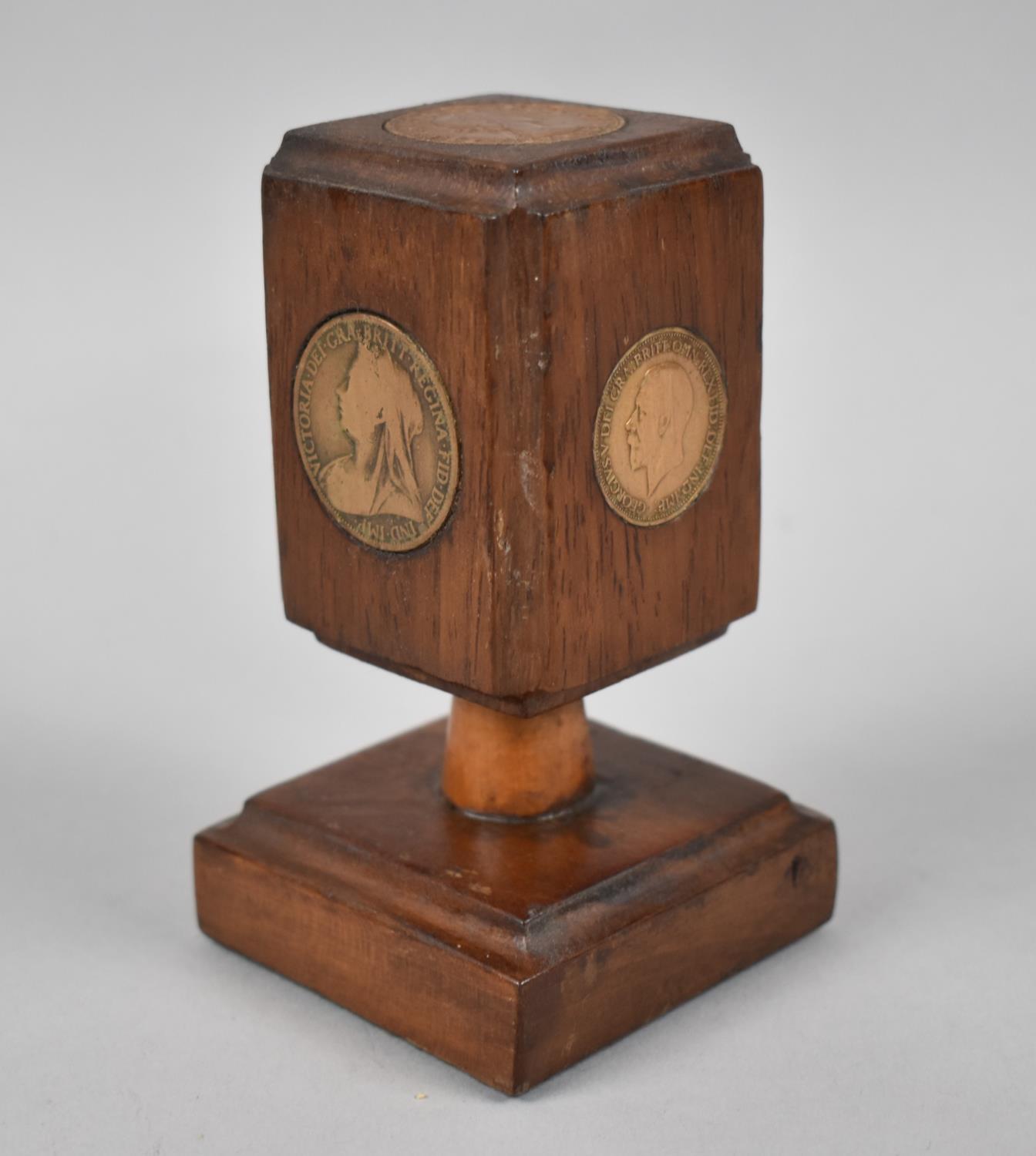 A Novelty Desk Top Wooden paperweight Mounted with Coins from Victoria to Elizabeth, 12cms High