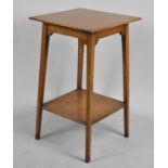 An Edwardian Square Topped Occasional Table with Stretcher Shelf, 76cms High