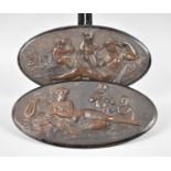 A Pair of Continental Oval Wall Hangings Moulded with Reclining Maidens and Cherubs with Musical