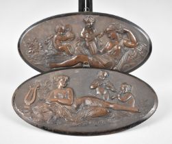 A Pair of Continental Oval Wall Hangings Moulded with Reclining Maidens and Cherubs with Musical
