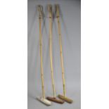 A Collection of Three Vintage Wooden Polo Sticks