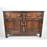 An Ercol Sideboard with Two Long Drawers Over Cupboard Base, 121cm wide