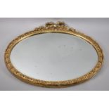 A Mid 20th century Gilt Framed Oval Wall Mirror with Ribbon and Bow Finial, 55x50cms Overall