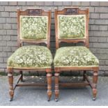 A Pair of Upholstered Edwardian Carved Oak Framed Side Chairs