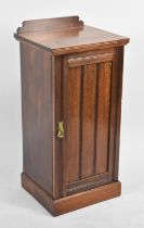 An Edwardian Mahogany Galleried Bedside Cabinet with Panelled Door to Shelved Interior, 38cms Wide