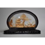 A Finely Carved Corkwood Oriental Diorama Depicting Pagoda and Cranes, Black Lacquered Oval Case