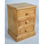 A Mid 20th Century Three Drawer Stained Pine Bedside Chest, 48cm wide