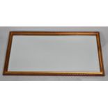 A Mid 20th Century Gilt Framed Bevel Edge Wall Mirror, 64x34cm